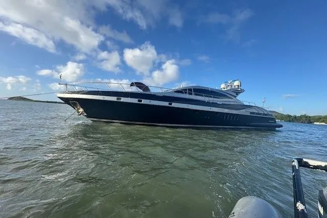 Slide: The Image of Luxury 2005 Mangusta 92 yacht cruising on a sunny day. - 6