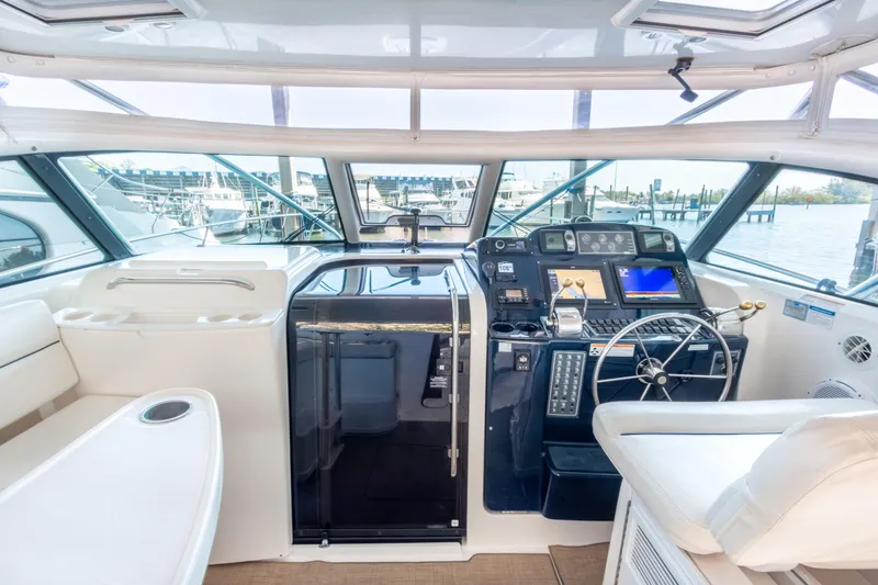 Slide: The Image of 2007 Tiara Yachts 3800 Open helm with modern navigation equipment and comfortable seating. - 10