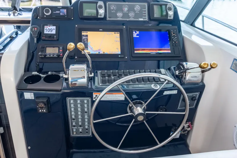 Slide: The Image of Helm of 2007 Tiara Yachts 3800 Open with navigation and control systems. - 11