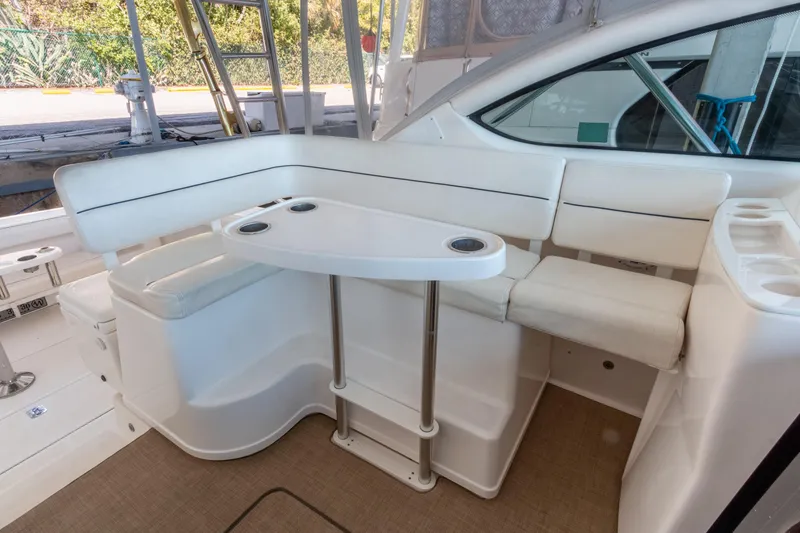 Slide: The Image of 2007 Tiara Yachts 3800 Open interior with white seating and table. - 16