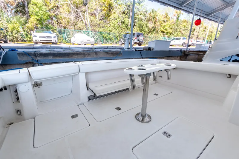 Slide: The Image of 2007 Tiara Yachts 3800 Open cockpit with white seating and fishing rod holders. - 18