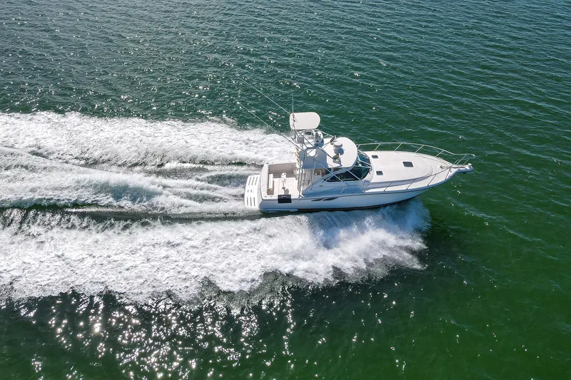 Slide: The Image of 2007 Tiara Yachts 3800 Open cruising on open water, creating a dynamic wake. - 2