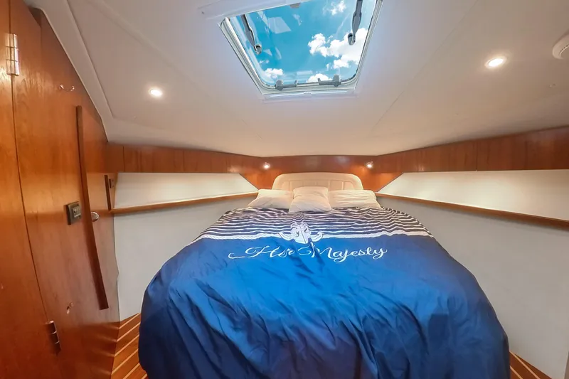 Slide: The Image of Luxurious cabin interior of 2007 Tiara Yachts 3800 Open with skylight and cozy bedding. - 23