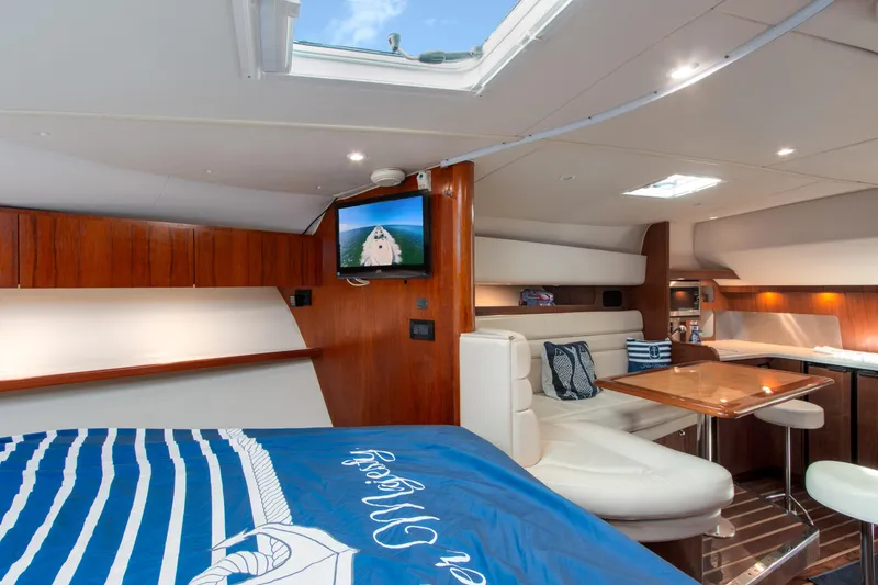Slide: The Image of Luxurious interior of 2007 Tiara Yachts 3800 Open with cozy seating and elegant wood finishes. - 29
