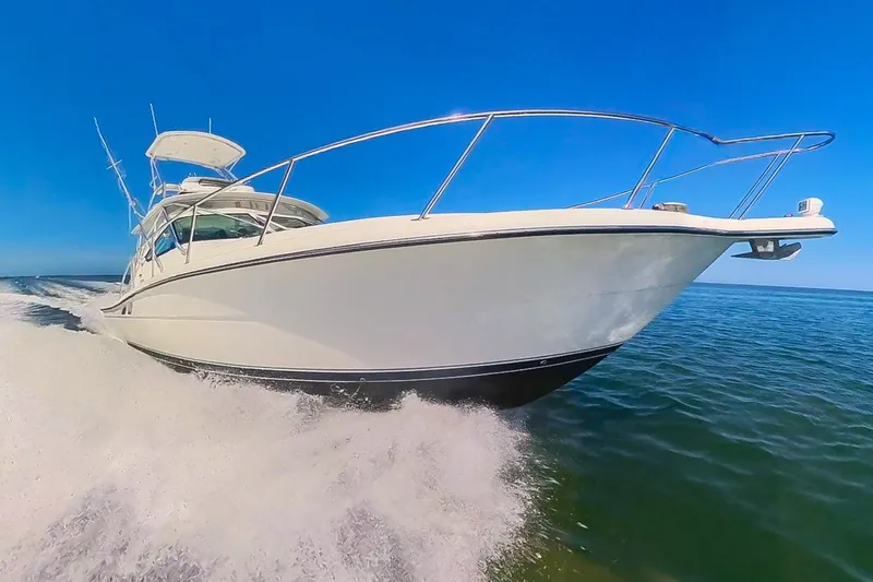 Slide: The Image of 2007 Tiara Yachts 3800 Open cruising on clear blue waters. - 3