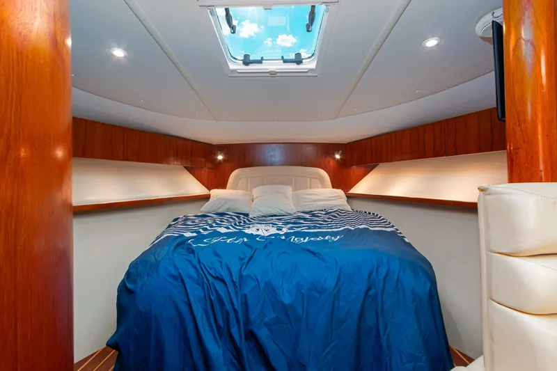 Slide: The Image of Luxurious cabin interior of 2007 Tiara Yachts 3800 Open with skylight and cozy bedding. - 30