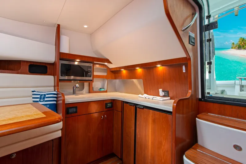 Slide: The Image of Luxurious 2007 Tiara Yachts 3800 Open interior with kitchenette and ocean view. - 31
