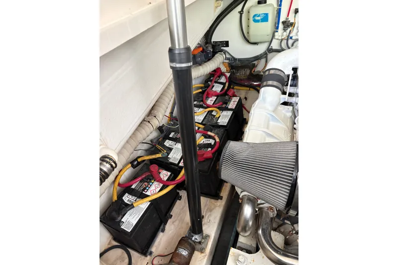 Slide: The Image of Engine compartment of a 2007 Tiara Yachts 3800 Open, featuring batteries and wiring. - 39