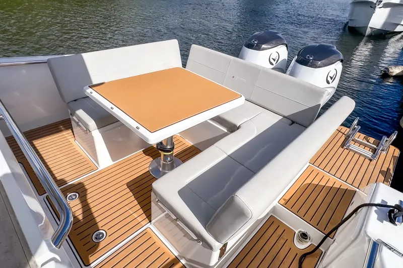 Slide: The Image of Luxurious 2025 STERK 31 boat interior with elegant seating and table on deck. - 7