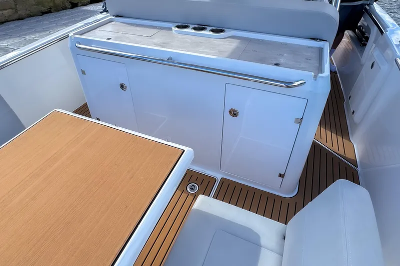 Slide: The Image of Luxury STERK 31 boat interior with sleek design and wooden flooring, 2025 model. - 9