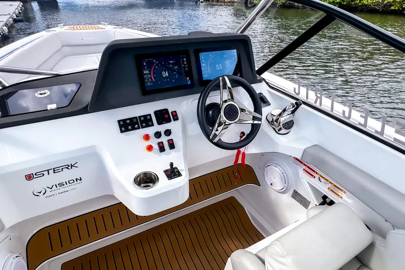 Slide: The Image of Modern STERK 31 boat cockpit with advanced controls and digital displays, 2025 model. - 10