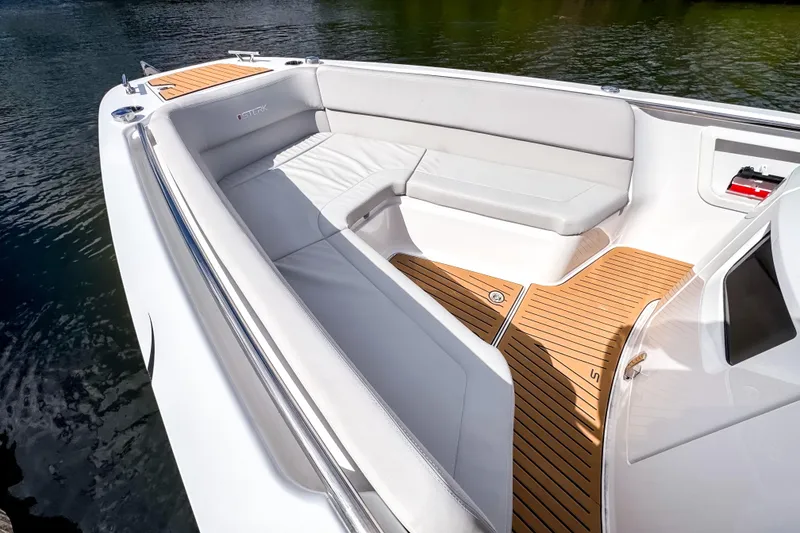 Slide: The Image of Luxurious 2025 STERK 31 boat interior with sleek seating and wooden flooring. - 12