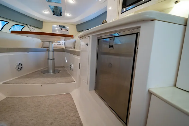 Slide: The Image of Interior of 2016 Intrepid 400 Cuddy boat with seating and table. - 104