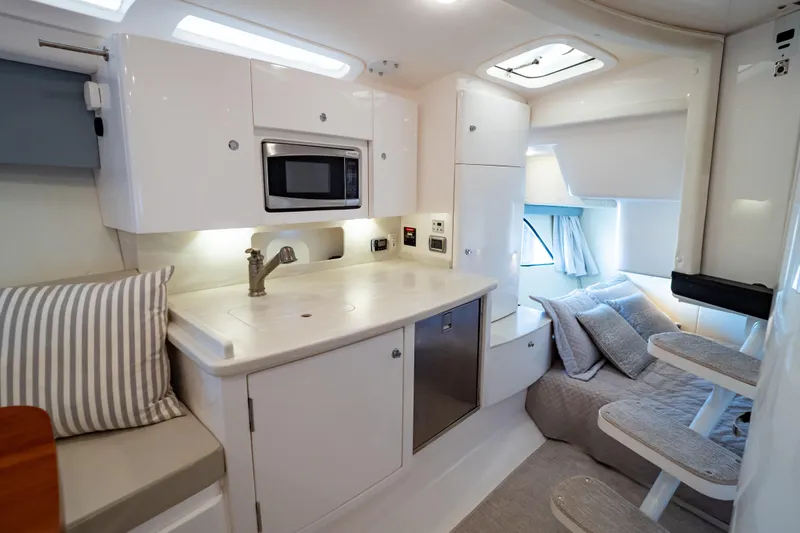 Slide: The Image of Luxurious interior of 2016 Intrepid 400 Cuddy boat with modern kitchen and cozy sleeping area. - 122
