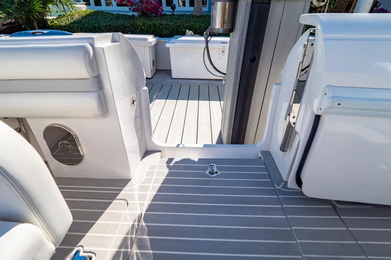 Slide: The Image of 2016 Intrepid 400 Cuddy boat interior with sleek seating and deck design. - 131