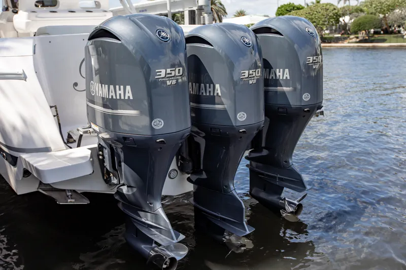 Slide: The Image of 2016 Intrepid 400 Cuddy with triple Yamaha 350 V8 outboard engines on water. - 19