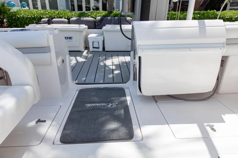 Slide: The Image of 2016 Intrepid 400 Cuddy boat interior with seating and storage compartments. - 20