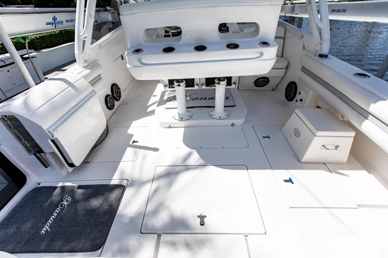 Slide: The Image of 2016 Intrepid 400 Cuddy boat interior with seating and storage compartments. - 22