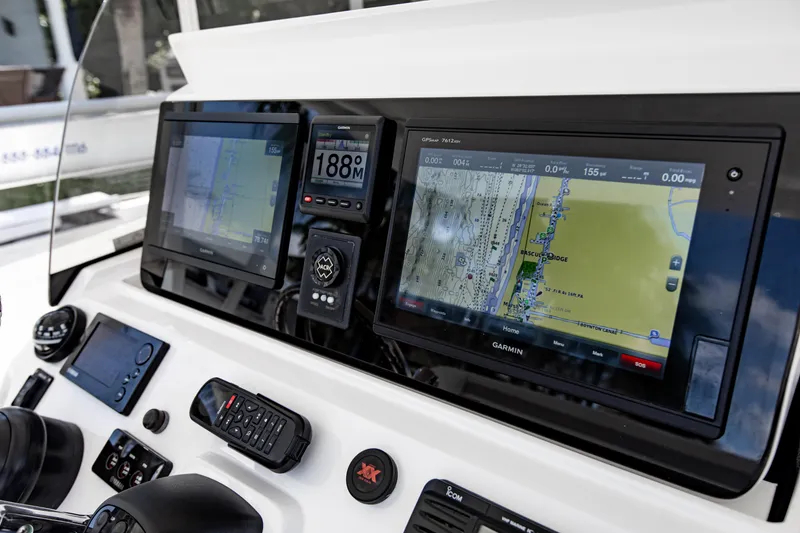 Slide: The Image of Dashboard of a 2016 Intrepid 400 Cuddy with advanced navigation systems. - 28