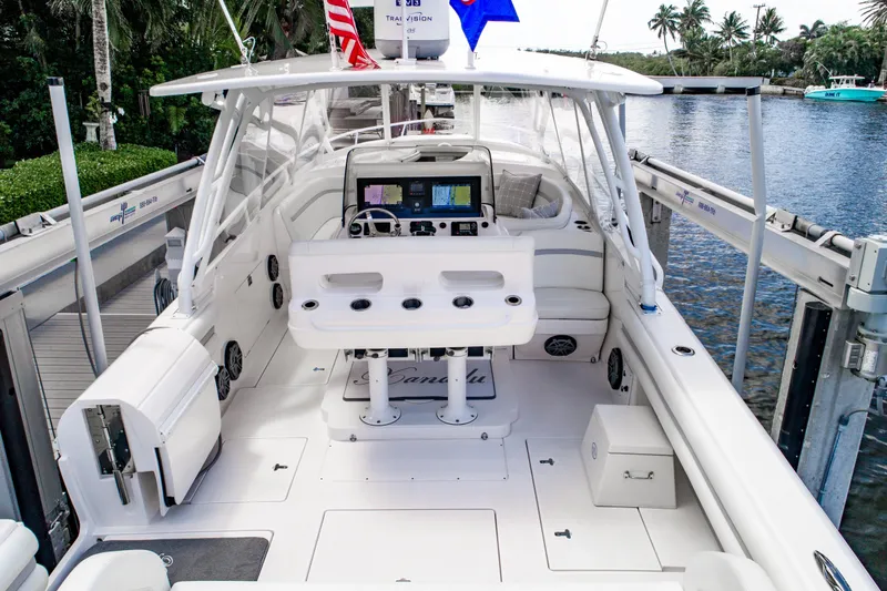 Slide: The Image of 2016 Intrepid 400 Cuddy boat interior with helm, seating, and navigation equipment. - 40