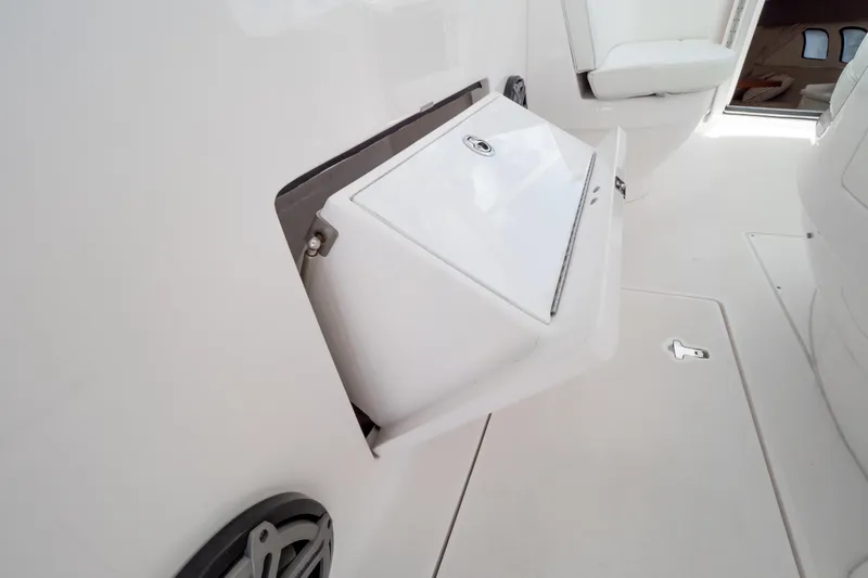 Slide: The Image of 2016 Intrepid 400 Cuddy interior with storage compartment and seating. - 50