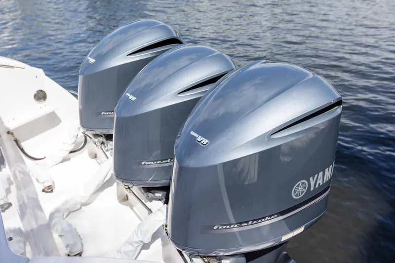 Slide: The Image of Triple Yamaha outboard engines on a 2016 Intrepid 400 Cuddy boat. - 6