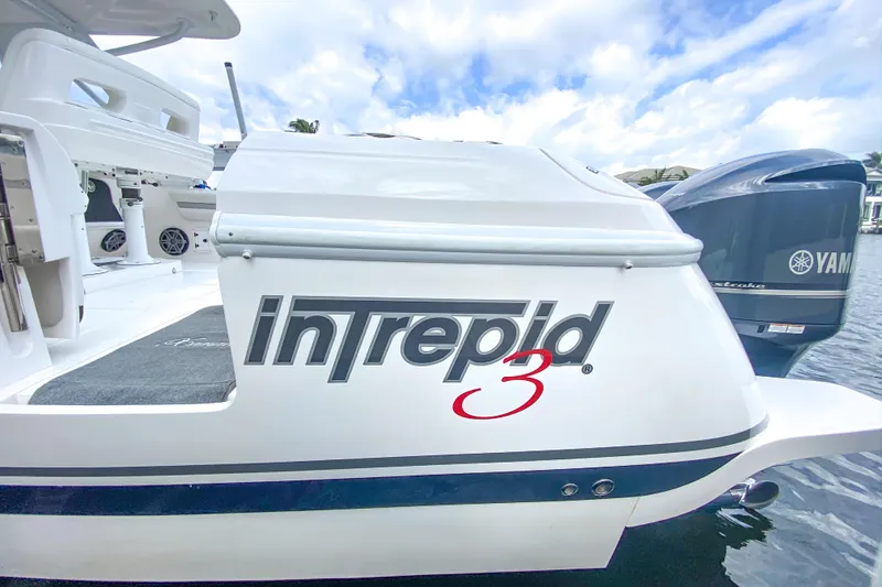 Slide: The Image of 2016 Intrepid 400 Cuddy boat with Yamaha engine, docked on a sunny day. - 66