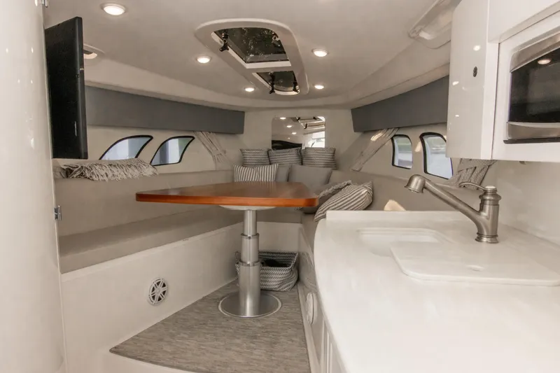 Slide: The Image of Luxurious interior of 2016 Intrepid 400 Cuddy boat with modern amenities and seating. - 74