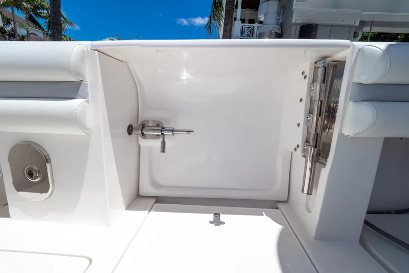 Slide: The Image of 2016 Intrepid 400 Cuddy boat interior detail with white seating and stainless steel fixtures. - 78