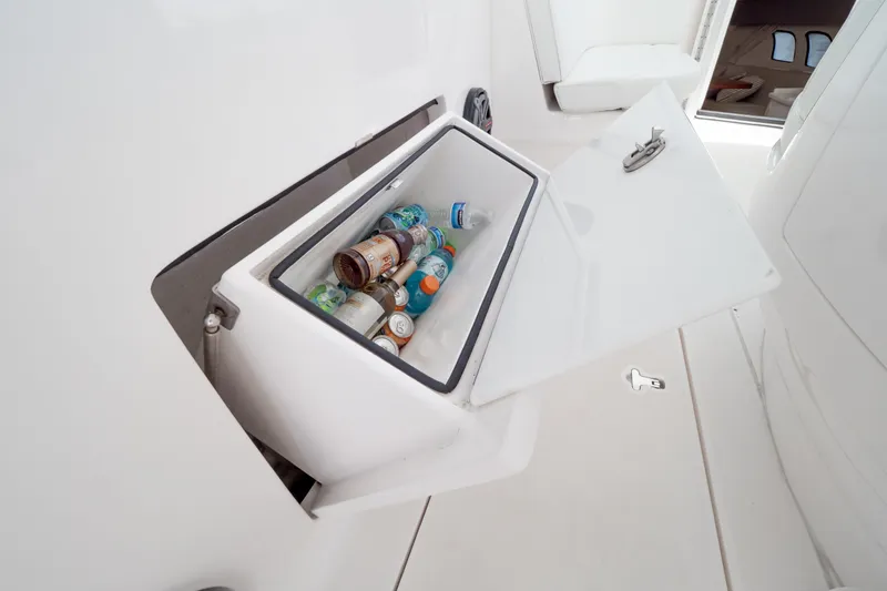 Slide: The Image of Built-in cooler with drinks on a 2016 Intrepid 400 Cuddy boat. - 82