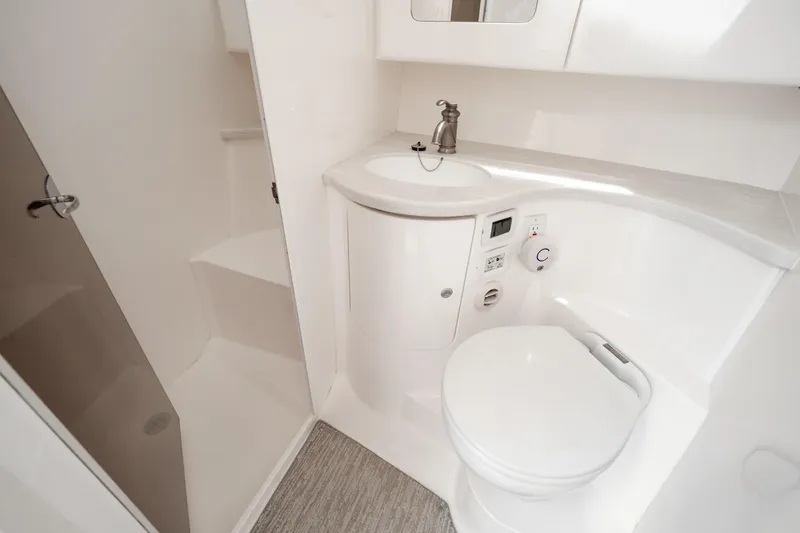 Slide: The Image of Luxurious 2016 Intrepid 400 Cuddy boat bathroom with modern fixtures and sleek design. - 86