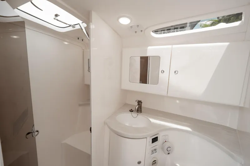 Slide: The Image of Luxurious bathroom interior of 2016 Intrepid 400 Cuddy boat, featuring sleek design and modern fixtures. - 87