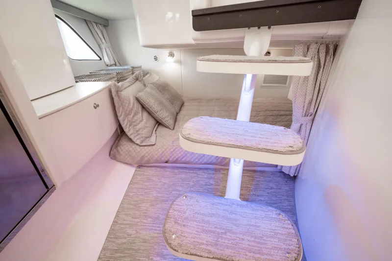 Slide: The Image of Interior of 2016 Intrepid 400 Cuddy, featuring cozy bedding and modern design elements. - 88