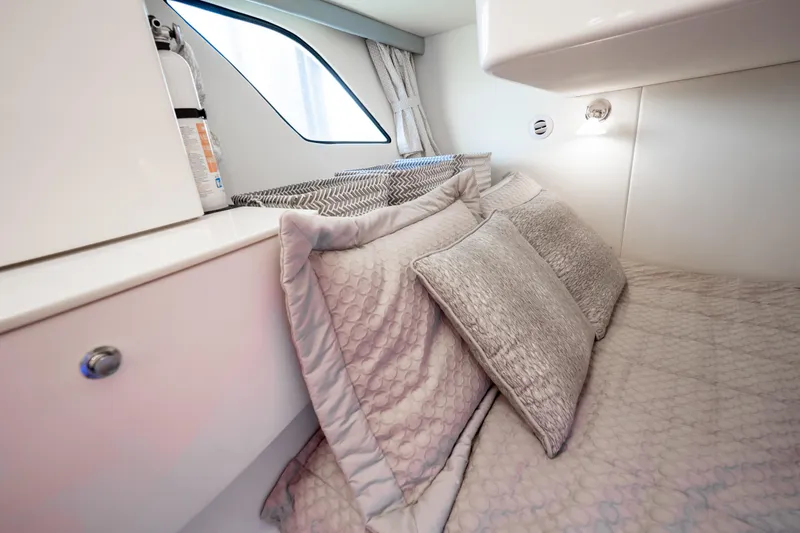Slide: The Image of Cozy cabin interior of 2016 Intrepid 400 Cuddy with plush bedding and modern design. - 89