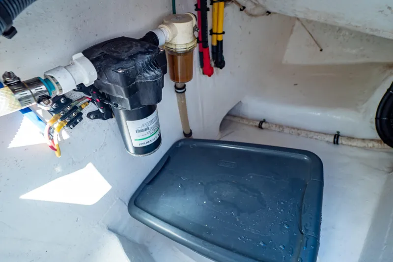 Slide: The Image of 2016 Intrepid 400 Cuddy interior showing plumbing and storage area. - 94