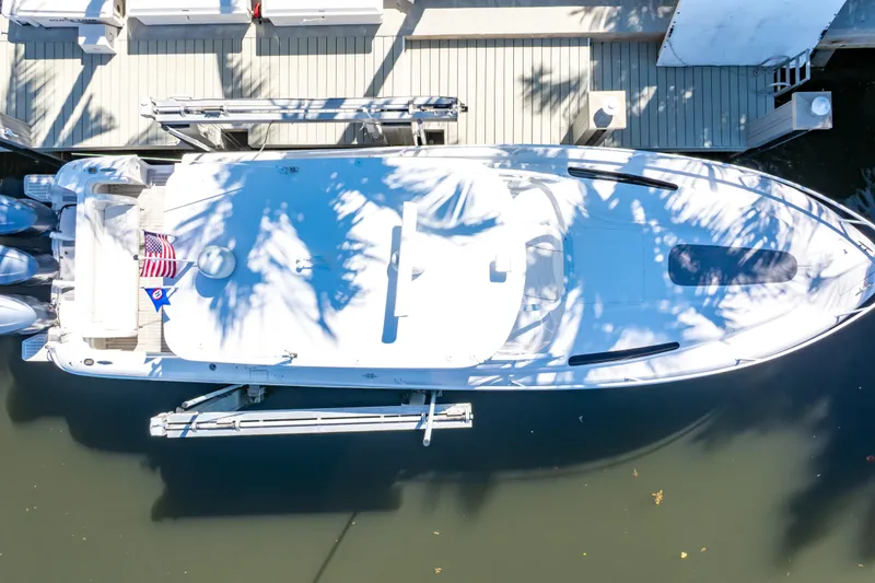 Slide: The Image of Overhead view of 2016 Intrepid 400 Cuddy boat docked by a pier. - 99
