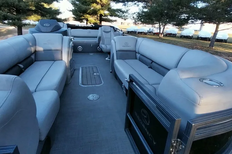 Slide: The Image of 2021 Regency 230 LE3 Sport pontoon boat interior with spacious seating and modern design. - 13