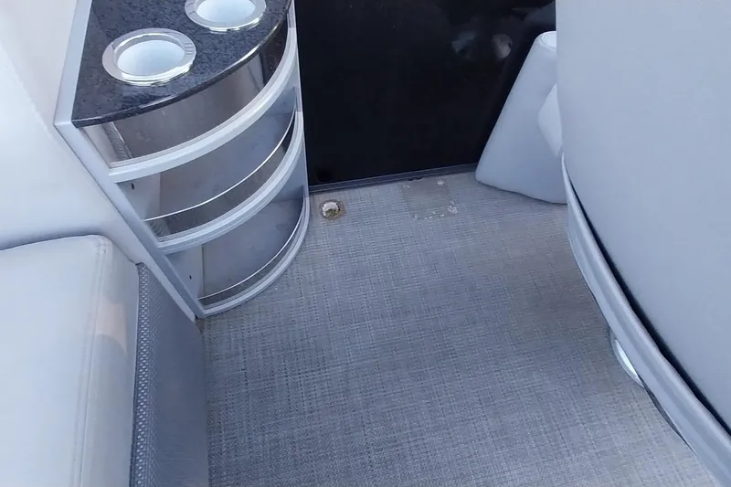 Slide: The Image of Interior of 2021 Regency 230 LE3 Sport boat with cup holders and seating. - 18