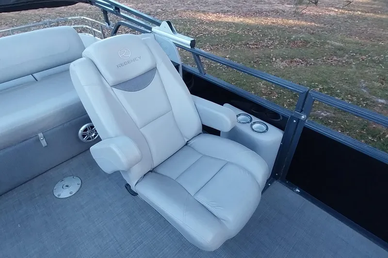 Slide: The Image of Luxurious seating on 2021 Regency 230 LE3 Sport pontoon boat with cup holders. - 21