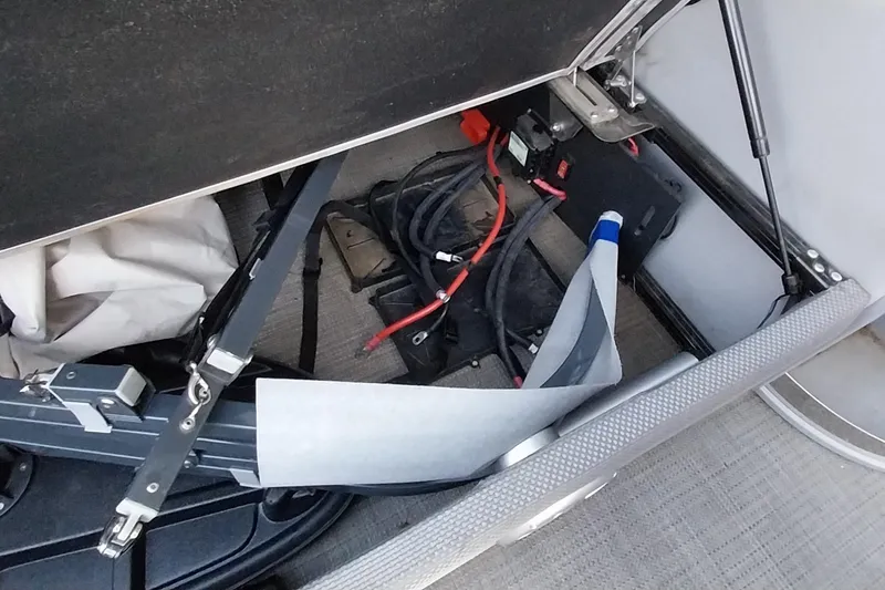 Slide: The Image of Storage compartment of 2021 Regency 230 LE3 Sport boat with cables and equipment. - 23
