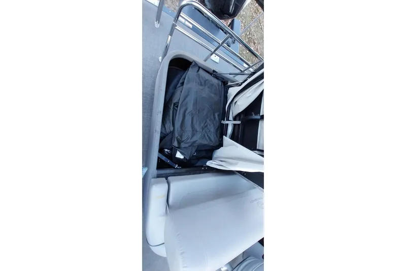 Slide: The Image of Interior storage compartment of 2021 Regency 230 LE3 Sport boat. - 24