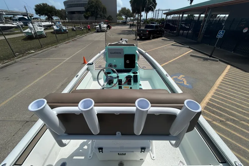 Slide: The Image of Avid 21 Mag 2026 boat with Garmin system, docked in a parking area. - 12