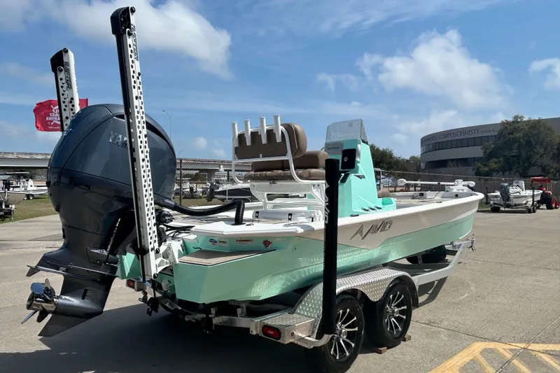 Slide: The Image of Avid 21 Mag 2026 boat on trailer, featuring sleek design and powerful outboard motor. - 5