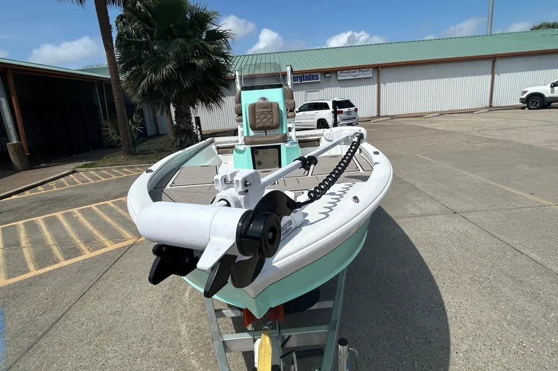 Slide: The Image of Avid 21 Mag 2026 boat with trolling motor in parking lot. - 7