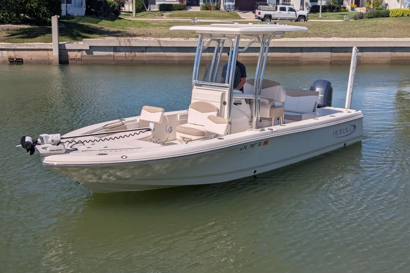 Slide: The Image of 2021 Robalo 226 Cayman boat on calm water, featuring sleek design and modern amenities. - 3