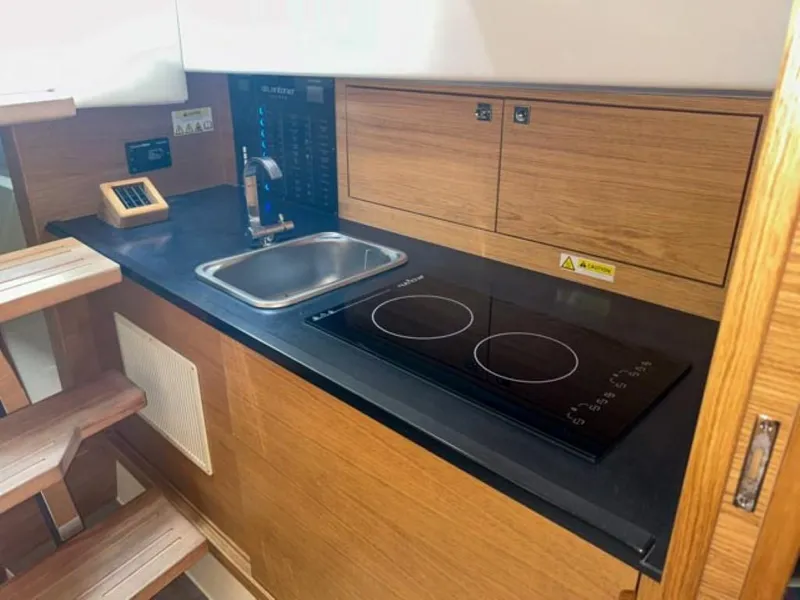 Slide: The Image of 2023 De Antonio Yachts D42 Open kitchen with sink and electric stove. - 16