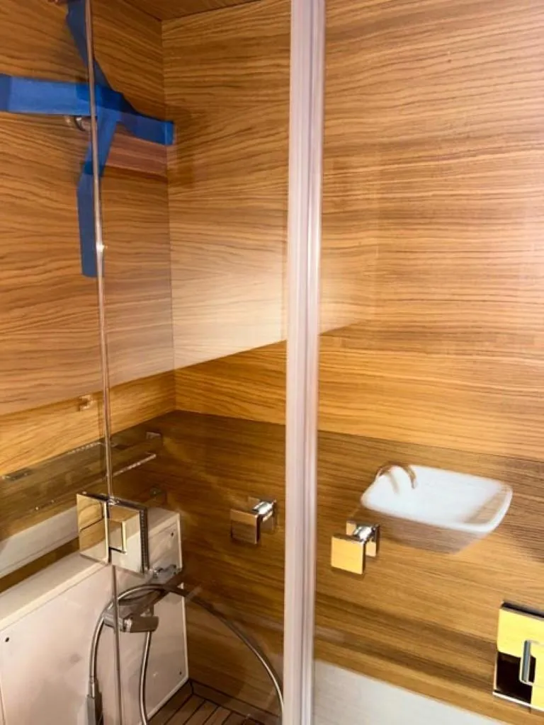 Slide: The Image of 2023 De Antonio Yachts D42 Open bathroom with modern wood paneling and sleek fixtures. - 21