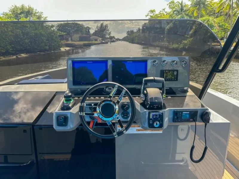 Slide: The Image of 2023 De Antonio Yachts D42 Open helm with dual screens and modern controls. - 13