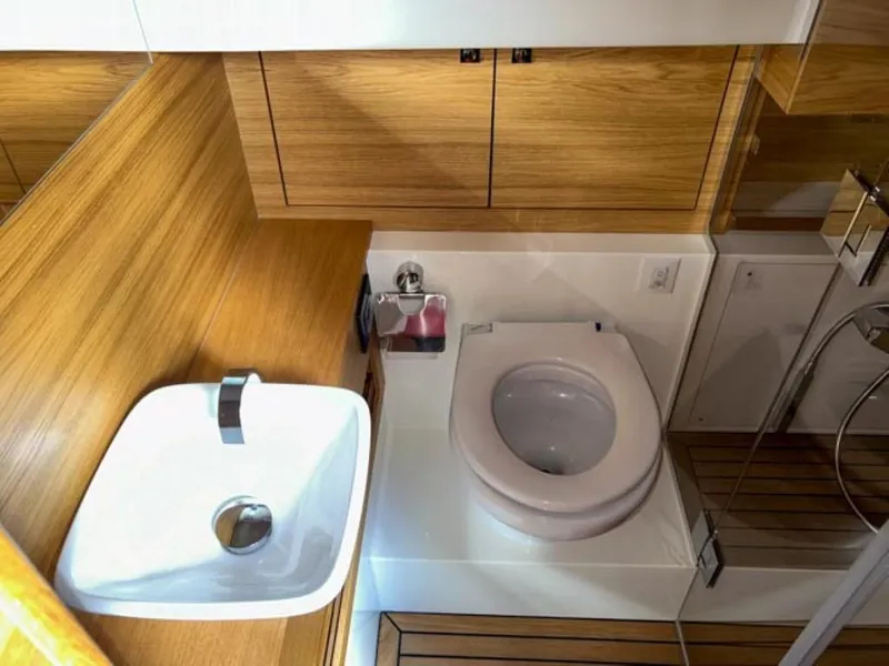 Slide: The Image of Modern bathroom in 2023 De Antonio Yachts D42 Open with wooden cabinetry. - 20