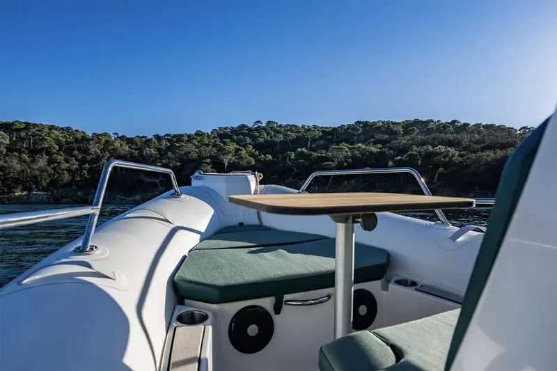 Slide: The Image of Manufacturer Provided Image: Zodiac Medline 5.8 boat, 2026 model, on calm water near wooded shoreline. - 4